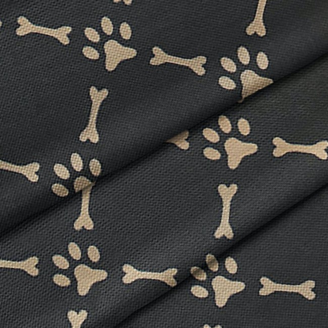 Tissu imperméable - Oxford pieds du chien et les os sur noir
