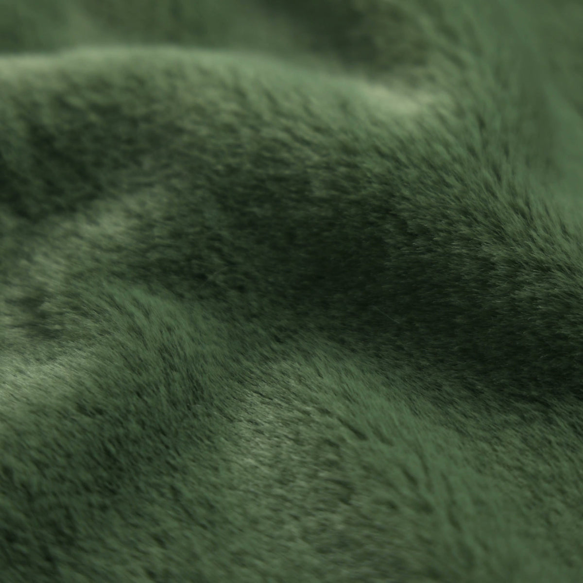 Tissu fausse fourrure tricotée douce CORTO - vert bouteille