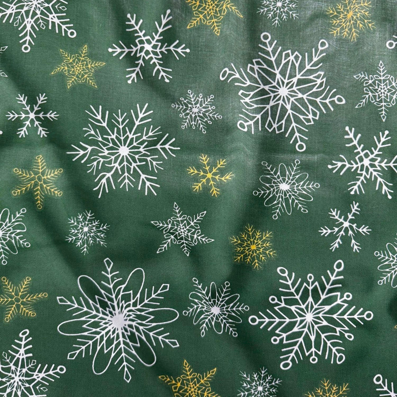 Cotton Fabric - White and gold snowflakes on green background